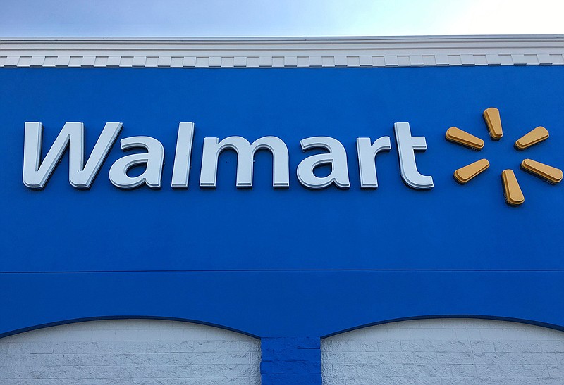 This Thursday, Jan. 5, 2017, file photo shows corporate signage at a Walmart in Kissimmee, Fla. Just over a year after Walmart spent more than $3 billion for the fast-growing online retailer Jet.com, it will launch a grocery line targeting millennials as it tries to contain Amazon.com. In August 2017, Amazon closed on its acquisition of Whole Foods, intensifying the competition between Walmart, Target, and supermarkets all fighting to win a bigger slice of the grocery market. 