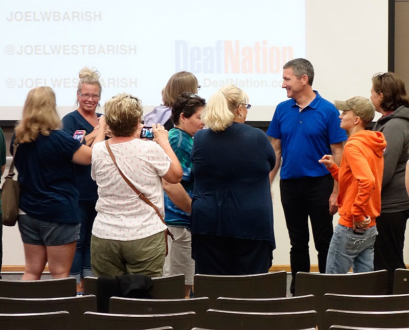 Joel Barish (blue shirt), founder and CEO of DeafNation, visited the campus of William Woods University on Thursday evening, Sept. 28, 2017 to talk about his travels to 85 countries. On these journeys, he seeks out deaf people, often from very isolated communities, and interviews them for documentaries. 