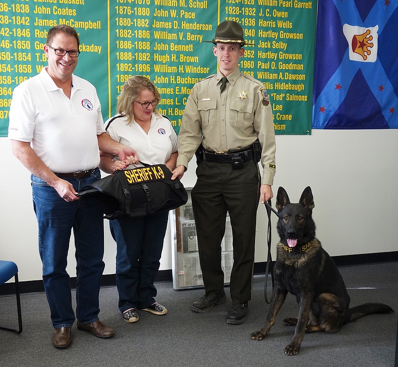<p>Jenny Gray/FULTON SUN</p><p>Callaway County Sheriff’s Office K9 Iro and his handler, Deputy Alan LeBel, received a protective vest Friday from Donna and Jim Wilson, founders of the organization Going to the Dogs. The Wilsons drove to Fulton late Friday from Overland Park, Kansas, to meet the team.</p>