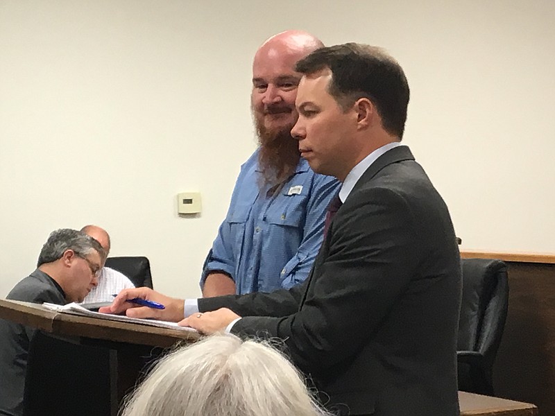 Local pastor David Farren stands with Texarkana lawyer Jason Horton at a hearing Tuesday morning before Circuit Judge Carlton Jones at the Miller County jail. Farren pleaded guilty to multiple counts involving the sexual abuse of two teen girls who participated in youth ministry groups Farren led at several Texarkana churches. Farren was sentenced to 15 years in prison.