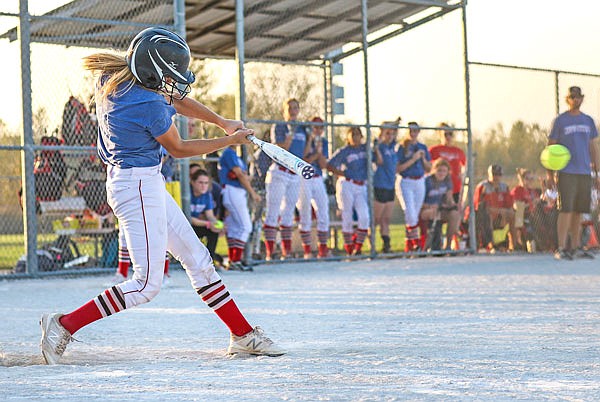 Jefferson City's Olivia Wallace hits an RBI single in the fourth inning of Monday night's game against Pleasant Hope at 63 Diamonds.