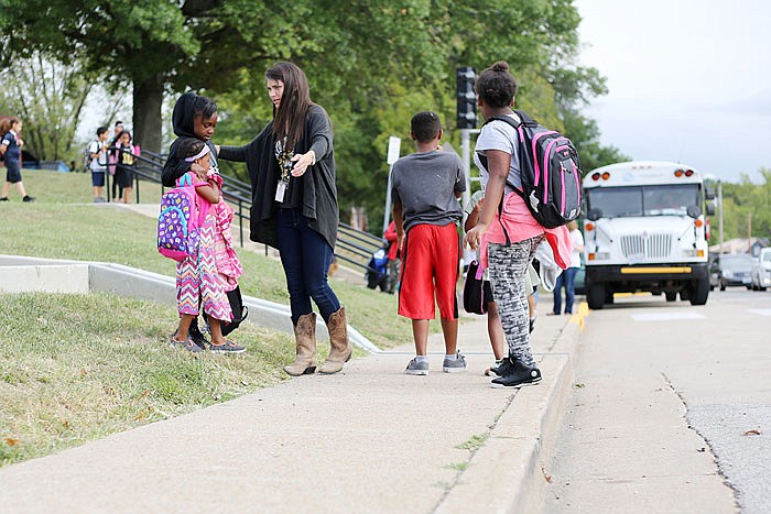 Students are let out of school Tuesday at East Elementary School. Sidewalks along East High Street are among improvements considered for the city-county joint projects list.