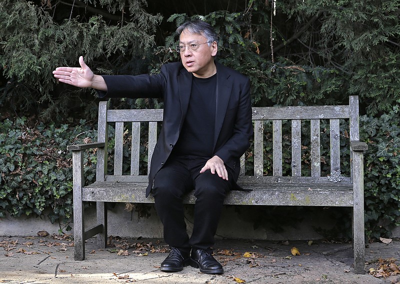 British novelist Kazuo Ishiguro gestures during a press conference at his home in London, Thursday Oct. 5, 2017. Ishiguro, best known for "The Remains of the Day," won the Nobel Literature Prize on Thursday, marking a return to traditional literature following two years of unconventional choices by the Swedish Academy for the 9-million-kronor ($1.1 million) prize. (AP Photo/Alastair Grant)