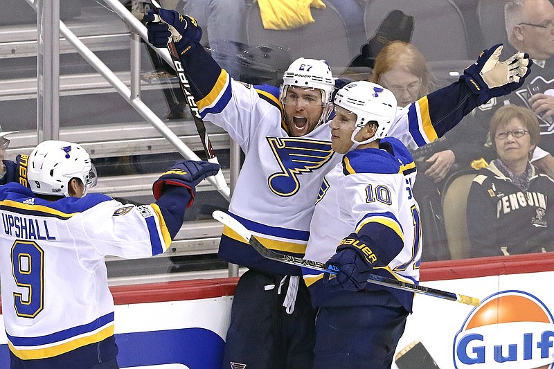 Alex Pietrangelo (left) of the Blues celebrates his game-winning overtime goal with Brayden Schenn following Wednesday night's game against the Penguins in Pittsburgh.