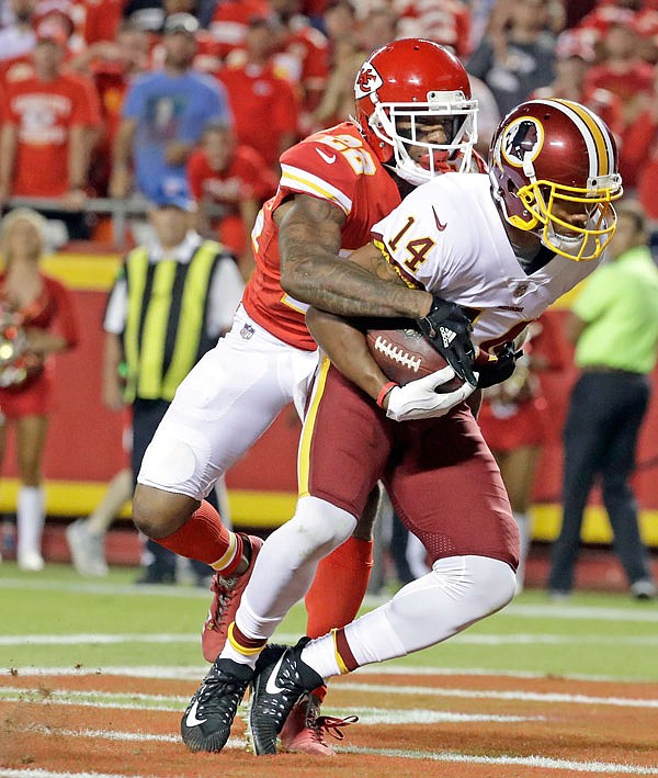 Redskins wide receiver Ryan Grant scores a touchdown against Chiefs defensive back Marcus Peters during the second half of Monday night's game at Arrowhead Stadium in Kansas City.