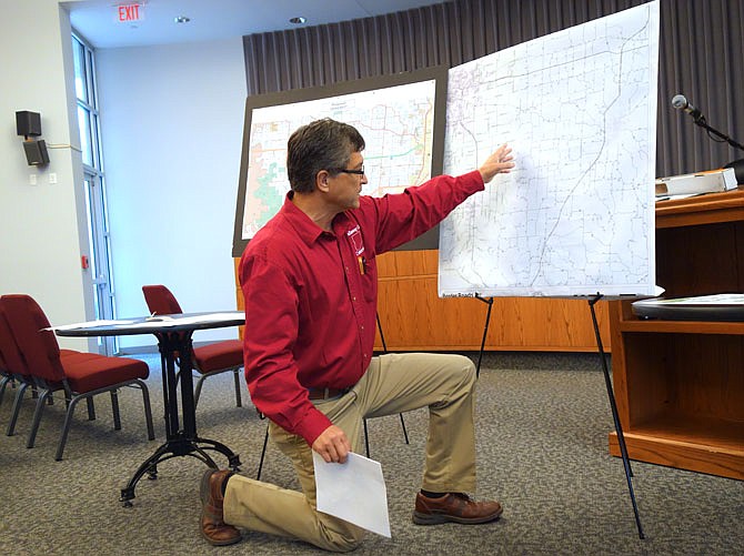 Roger Fischer, Western District county commissioner, gathered members of local and state government Wednesday to listen to his proposal for a new road. The road would extend from Fulton to near Ashland.