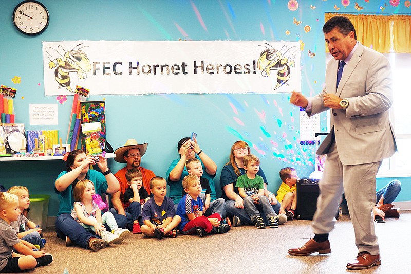 <p>Frank Gayaldo Jr., founder of World Autism and Savant Founation, talks to students, families and staff at Fulton Education Center. He stopped by Friday to recognize teacher Kara Wilkerson for her work in special education. (Helen Wilbers/FULTON SUN photo)</p>