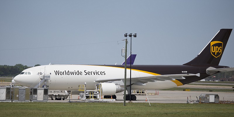 In this Tuesday, April 18, 2017 photo, a United Parcel Service cargo plane sits idle during the day as it awaits loading at Richmond International Airport in Sandston, Va..  UPS says in court records that it suspects one of its pilots obtained secret business plans for the shipping giant's aircraft fleet and posted them online. In a federal lawsuit filed the  week of Oct. 6, 2017, UPS says its strategic plans are highly confidential, and says a PowerPoint presentation was intended only for senior executives.(AP Photo/Steve Helber)