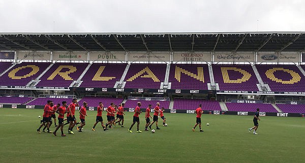 The United States men's soccer team warms up Thursday at practice in Orlando, Fla.