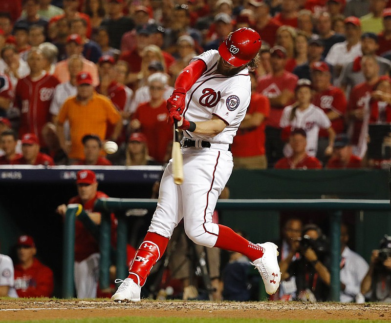 Washington Nationals Bryce Harper hits a two-run home run off Chicago Cubs relief pitcher Carl Edwards Jr. to tie the game in the eighth inning in Game 2 of baseball's National League Division Series a, at Nationals Park, Saturday, Oct. 7, 2017, in Washington. 
