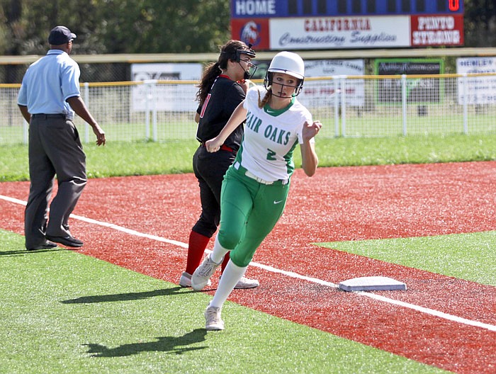 Macey Stockman of Blair Oaks rounds third base during the first inning of Saturday's championship
game against Eugene in the Class 2 District 10 Tournament at California, Mo.