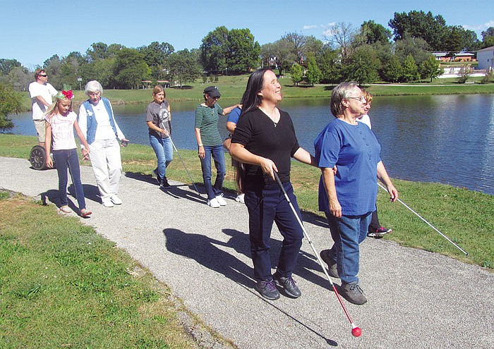 More than a dozen people walked Sunday  at the 30th annual National Federation for the Blind Walk-a-thon at McKay Park. The walk raises money and brings attention to issues faced by the blind. Some of the attendees planned to walk 30 laps around the lake, or about 18 miles.