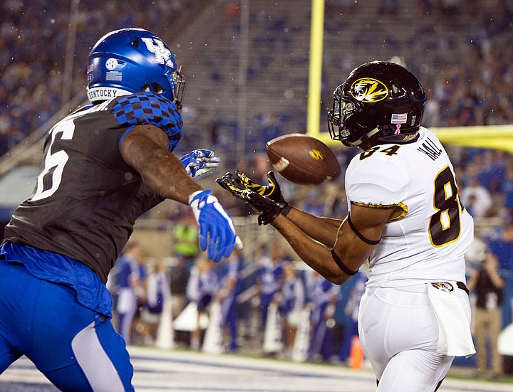 Missouri wide receiver Emanuel Hall catches a touchdown pass behind Kentucky cornerback
Lonnie Johnson during the first half of Saturday night's game in Lexington, Ky.