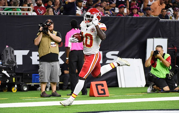 Chiefs kick returner Tyreek Hill scores a touchdown on an 82-yard punt return during the second half Sunday's game against the Texans in Houston.