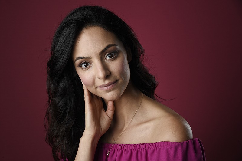 FILE - In this Aug. 2, 2017 file photo, Tala Ashe, a cast member in the CW series "DC's Legends of Tomorrow," poses for a portrait during the 2017 Television Critics Association Summer Press Tour in Beverly Hills, Calif.  Ashe is thrilled to debut her new character, a Muslim-American superhero joining season three of "DC's Legends of Tomorrow," airing Tuesday. (Photo by Chris Pizzello/Invision/AP, File)