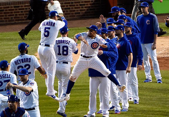 Cubs teammates Albert Almora Jr. and Javier Baez celebrate after Monday's win against the Nationals in Chicago.