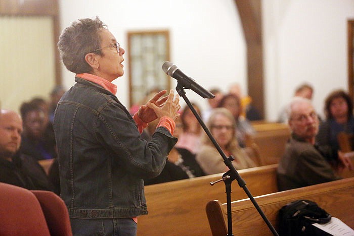 Joan Keenan speaks during the second public forum regarding racial disparity in the community Tuesday at One in Christ Baptist Church.