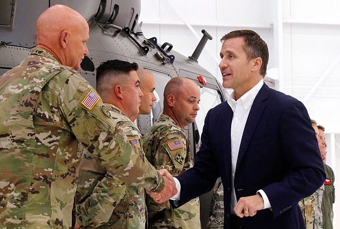 Gov. Eric Greitens shakes the hand of Missouri National Guard First Sgt. Howard Walker following his announcement of the Guard's expansion. "There are only so many spots that we are able to fill," Walker said," I think that the expansion will help."