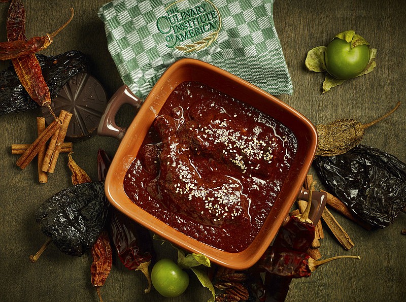 This 2017 photo provided by The Culinary Institute of America shows a mole Poblano in Hyde Park, N.Y. This dish is from a recipe by the CIA. (Phil Mansfield/The Culinary Institute of America via AP)