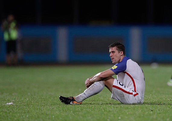 Matt Besler of the United States sits on the field after Tuesday night's 2-1 loss to Trinidad and Tobago in a 2018 World Cup qualifying match in Couva, Trinidad.