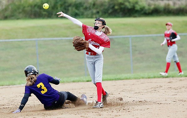 Calvary Lutheran second baseman Anna Zimmerman throws to first base after Samarah Bailey of Pilot Grove is out on a force play during Wednesday's Class 1 sectional game at Calvary.