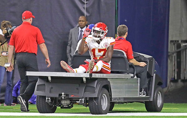 Chiefs wide receiver Chris Conley is taken off the field on a cart after he ruptured his Achilles tendon during the second half of last Sunday's game against the Texans in Houston.