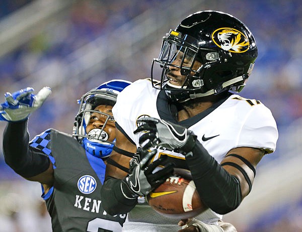 Missouri wide receiver Richaud Floyd catches a touchdown pass in front of Kentucky cornerback Jordan Griffin during the second half of Saturday's game in Lexington, Ky.