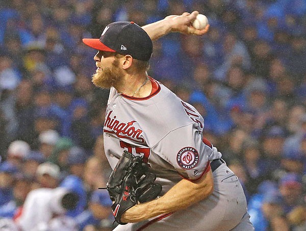 Nationals starting pitcher Stephen Strasburg throws to the plate during the seventh inning of Game 4 of the NLDS against the Cubs on Wednesday in Chicago.
