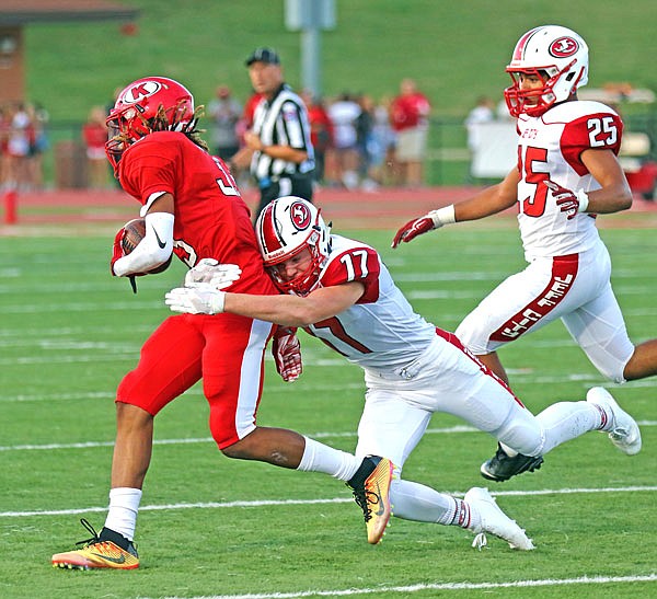 Jefferson City safety Ryan Brooks tackles Cornell Young IV of Kirkwood during a Week 2 game at Kirkwood.