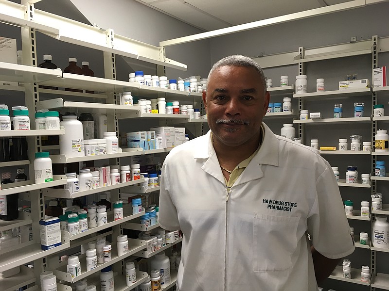 This Sept. 28, 2017, photo shows New Orleans pharmacist Ruston Henry in his business in Eastern New Orleans. Survivors coped with problems for years after Hurricane Katrina decimated coastal Mississippi and Louisiana and flooded New Orleans. "There were so many questions," recalls pharmacist Ruston Henry, who lost his business in the Lower 9th Ward as his home flooded in the Gentilly neighborhood. "Can it be rebuilt? Can it not be rebuilt?  (AP Photo/Kevin McGill)