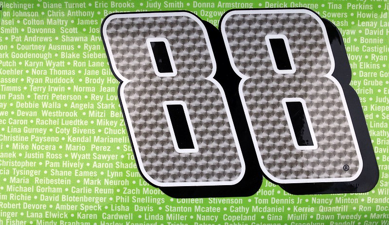 NASCAR Cup Series driver Dale Earnhardt Jr.'s car has thousands of names written on it as part of a promotion to Ride with Dale for his last race at Talladega, Saturday, Oct. 14, 2017, in Talladega, Ala. (AP Photo/Butch Dill)