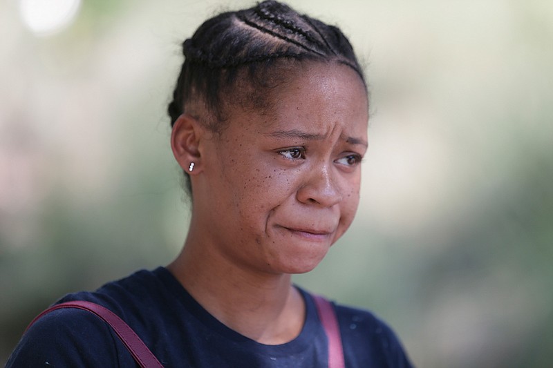 In this Thursday, Sept. 14, 2017 photo, Harvey evacuee Paige Cane pauses while speaking in downtown Dallas. Cane evacuated with her family from Port Arthur, Texas, during flooding. Rental housing has been a concern in many cities in Texas and Florida after hurricanes Harvey and Irma flooded tens of thousands of homes. 
