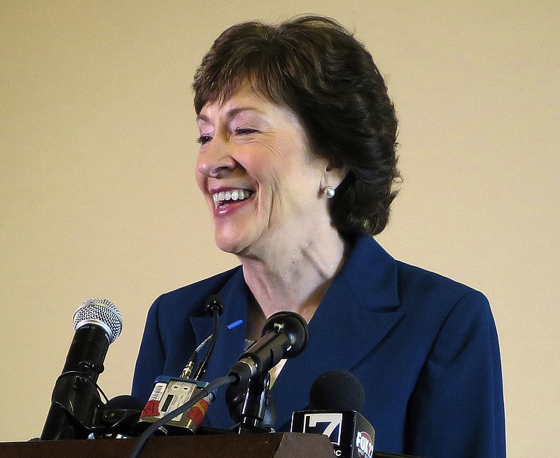 Sen. Susan Collins, R-Maine, smiles during a news conference Friday, Oct. 13, 2017, in Rockland, Maine, after announcing she will remain in the U.S. Senate and not run for governor. (AP Photo/David Sharp)