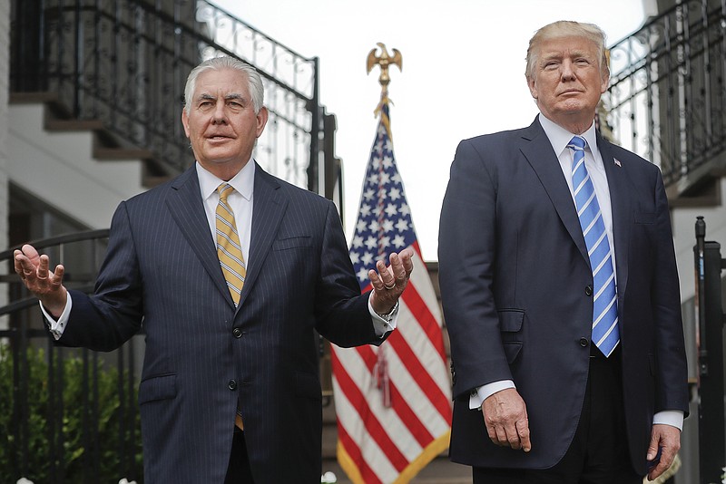 FILE - In this Aug. 11, 2017, file photo, Secretary of State Rex Tillerson, left, speaks following a meeting with President Donald Trump at Trump National Golf Club in Bedminster, N.J. The strained relationship between President Donald Trump and Secretary of State Rex Tillerson came under renewed focus Sunday, Oct. 15, during an interview with Jake Tapper on CNN, as Tillerson insisted that Trump has not undermined him even as he again refused to deny calling the president “a moron.”(AP Photo/Pablo Martinez Monsivais, File)