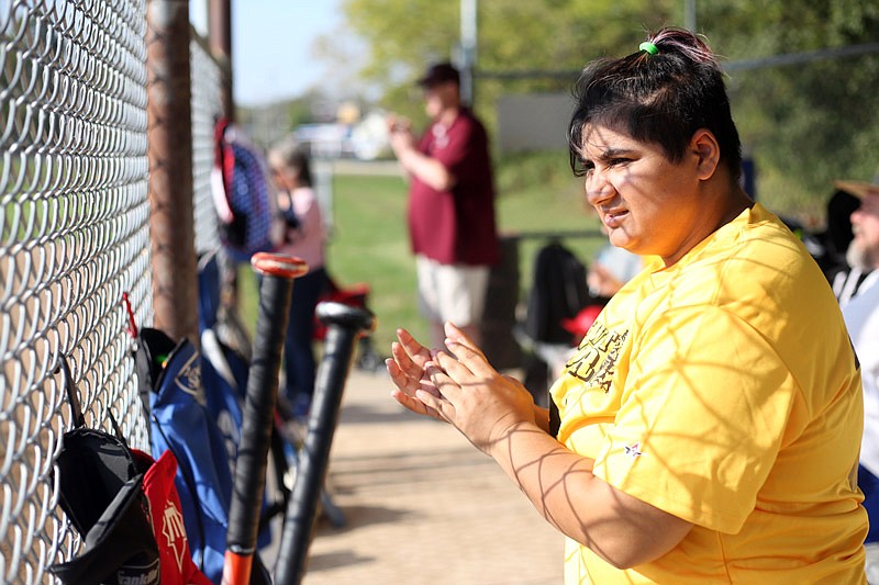 Florica Gault cheers on softball teammates Saturday, Oct. 14, 2017 during the Special Olympics Missouri State Outdoor Games at the Binder Sports Complex. The competition includes softball, golf, bocce ball, tennis, disc golf and flag football.