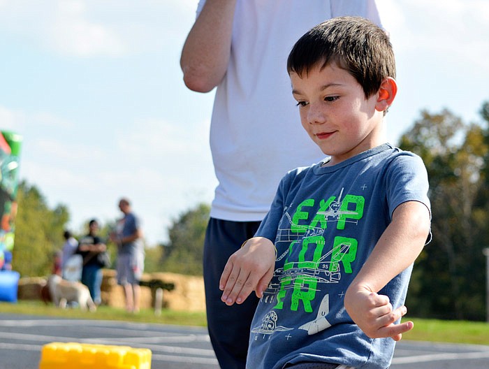 Paxsten Wilson dances to the song "Watch Me" by Silento on Saturday at Belair
Elementary School. The school was celebrating its 50th anniversary. Several different
activities were available to participants including throwing water balloons
at and duct taping teachers to a wall.