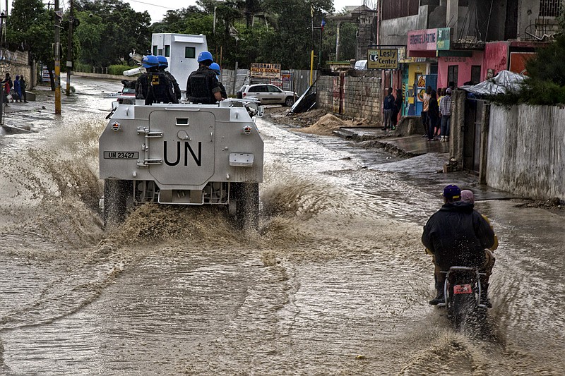 Brazilian peacekeepers with the UN Force Commander conduct a patrol in downtown Port au Prince in October 2016, in the wake of Hurricane Matthew. In 2017, after a 13-year stay, the United Nations' multinational military force is on its way out. 