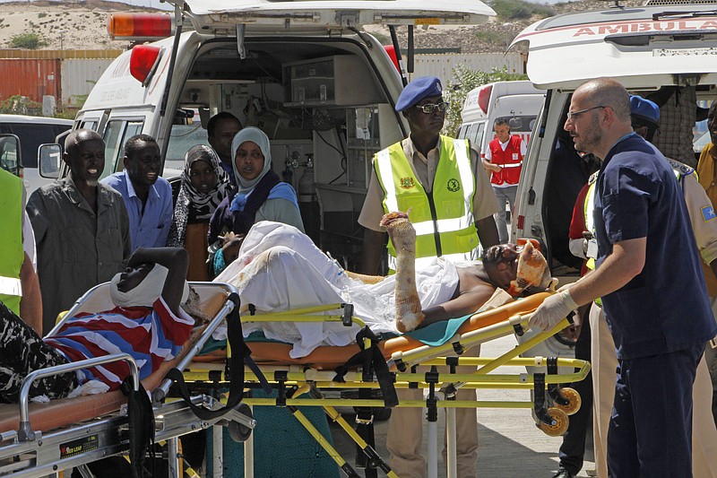 Turkish doctors transport a critically wounded man on a stretcher to a waiting Turkish air ambulance to airlift injured patients for treatment in Turkey, in Mogadishu, Somalia, Monday, Oct,16, 2017. The death toll from Saturday's truck bombing in Somalia's capital now exceeds 300, the director of an ambulance service said Monday, as the country reeled from the deadliest single attack. (AP Photo/Farah Abdi Warsameh)