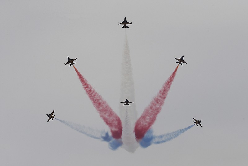South Korean Air Force's Black Eagles aerobatic team performs during the press day of the 2017 Seoul International Aerospace and Defense Exhibition at Seoul Airport in Seongnam, South Korea, Monday, Oct. 16, 2017. South Korean and U.S. troops launched five days of naval drills on Monday, three days after North Korea renewed its threat to fire missiles near the American territory of Guam. (AP Photo/Ahn Young-joon)