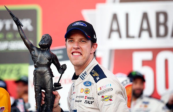 Brad Keselowski holds the trophy Sunday after winning the Alabama 500 at Talladega Superspeedway in Talladega, Ala.