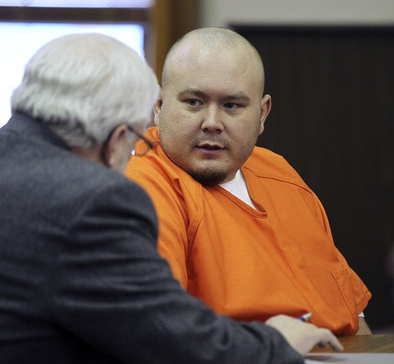 FILE - In this Jan. 19, 2011 file photo, Joshua Keadle, right, talks with his attorney Allen Fankhauser at his arraignment at the Nemaha County Courthouse in Auburn, Neb. Nebraska's top prosecutor has announced a murder charge in the case of a missing Peru State College student who disappeared nearly seven years ago. The Nebraska Attorney General's office said that Keadle has been charged with first-degree murder, accused of killing 19-year-old Tyler "Ty" Thomas. Thomas disappeared in the early morning hours of Dec. 3, 2010, after leaving a party near the southeast Nebraska campus. (AP Photo/James R. Burnett, Pool, File)