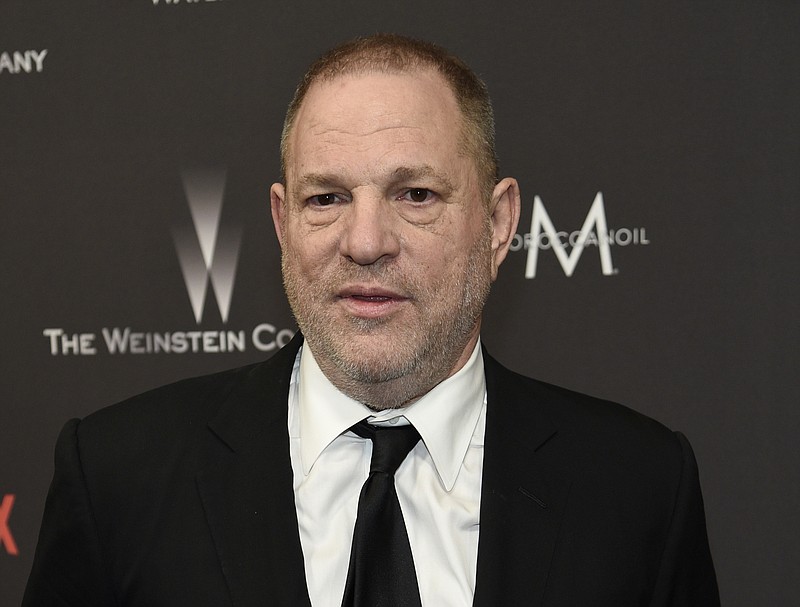 FILE - In this Jan. 8, 2017 file photo, Harvey Weinstein arrives at The Weinstein Company and Netflix Golden Globes afterparty in Beverly Hills, Calif. The Weinstein Co.’s board said in a statement Tuesday that Weinstein had resigned.  (Photo by Chris Pizzello/Invision/AP, File)