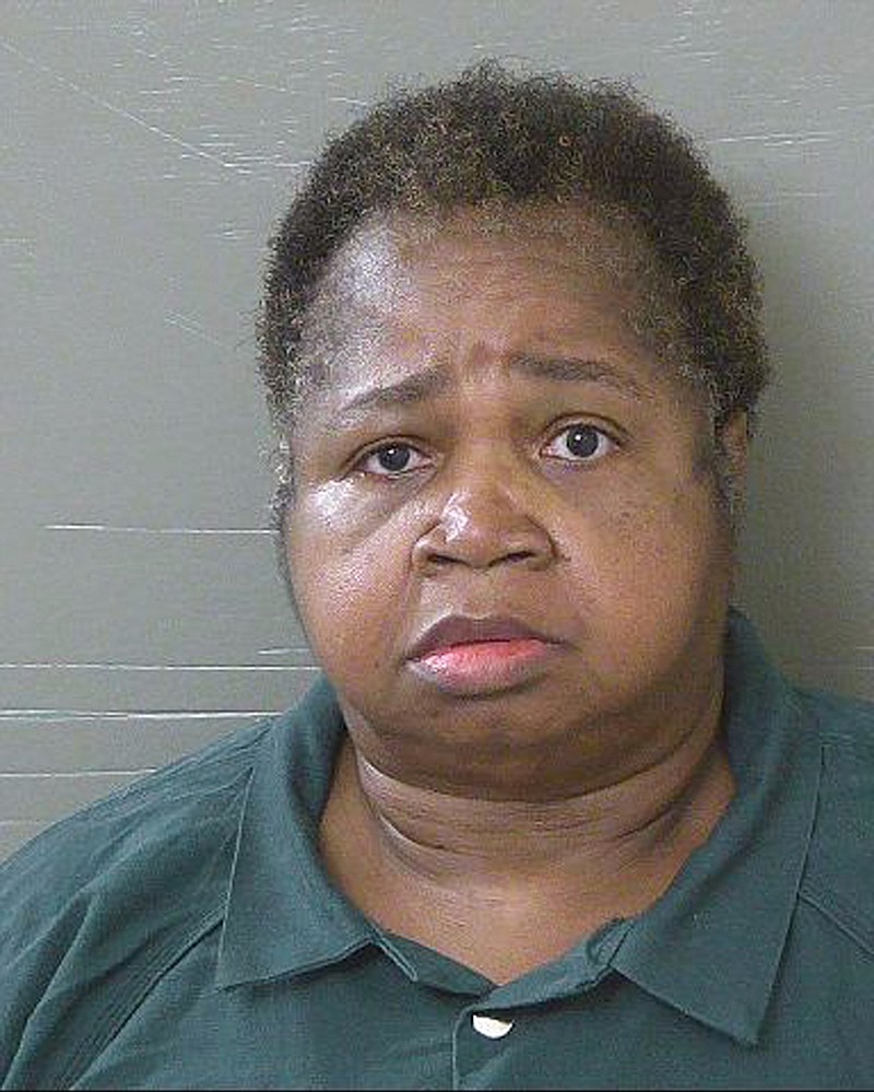 This Oct. 14, 2017, photo made available by the Escambia County Sheriff's Office, Fla., shows Veronica Green Posey under arrest. Posey is charged with killing her 9-year-old cousin by sitting on the child as punishment. Posey, who weighs 325 pounds, first punished the girl with a ruler and metal pipe before sitting on her for at least 10 minutes.