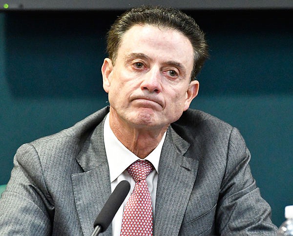 In this Oct. 20, 2016, file photo, Louisville head coach Rick Pitino reacts to a question during a press conference in Louisville, Ky. Louisville's Athletic Association officially fired Pitino on Monday.