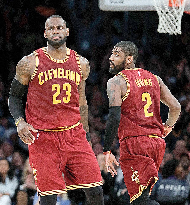 Cleveland Cavaliers' LeBron James, left, greets Kyrie Irving March 19 during the second half of a game against the Los Angeles Lakers in Los Angeles. There is bad blood once again in the NBA, and it's more individually driven—thanks in large part to social media. The back-and-forth makes for matchups worth circling on the calendar, beginning tonight with Boston-Cleveland.
