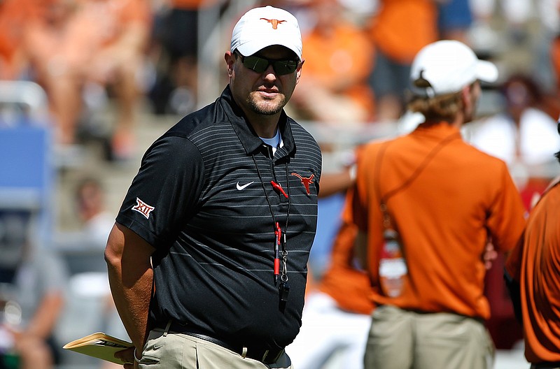 Texas head coach Tom Herman walks the field before playing Oklahoma in an NCAA college football game Saturday, Oct. 14, 2017, in Dallas, Texas.