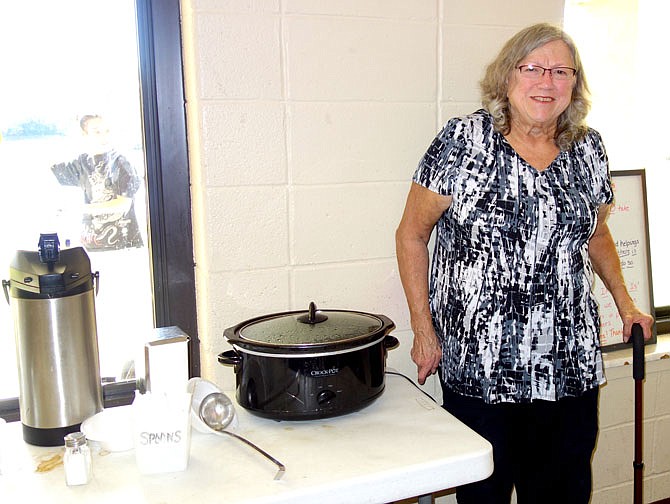 Ronda Hays, fundraising director for the Fulton Soup Kitchen, stands next to the remains of Tuesday's meal. The kitchen will be having a fundraising auction Saturday evening.