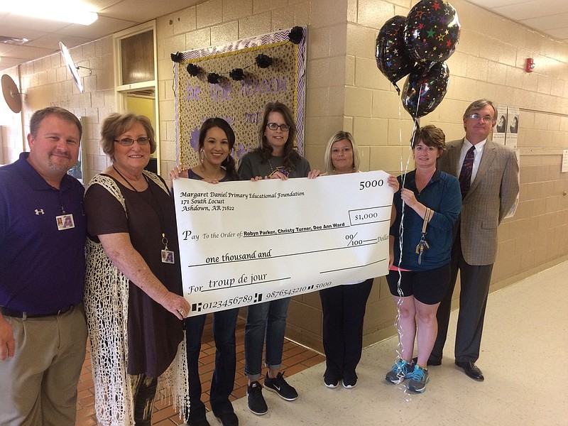 Dee Ann Ward, third from left, Christy Turner, middle, and Robyn Parker, third from right, recently received $1,000 from Ashdown School District's Margaret Daniel Education Foundation for arts integration classroom projects. Also pictured are, at left, Superintendent Jason Sanders and foundation Board Member Beth Provence; and at right, foundation Board Members Kari Harger and Thad Bishop.