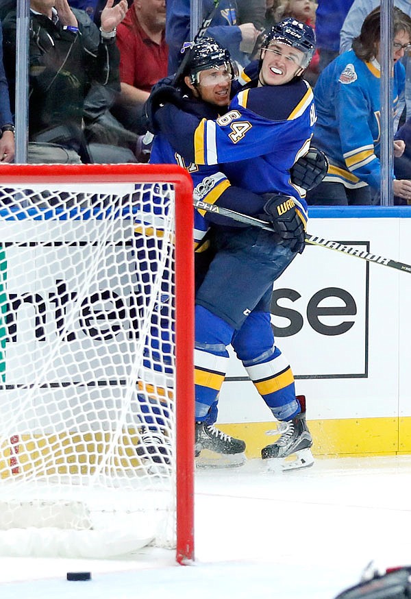 Jaden Schwartz of the Blues is congratulated by teammate Sammy Blais after scoring during the second period of Wednesday night's game against the Blackhawks in St. Louis.