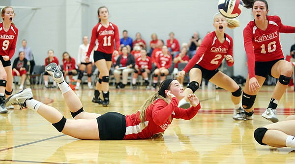 Grace Smith of Calvary Lutheran dives to the floor for a dig during Wednesday night's Class 1 District 12 championship match against New Haven at Calvary Lutheran.